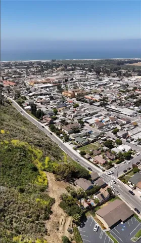 a view of a house with a mountain in the background