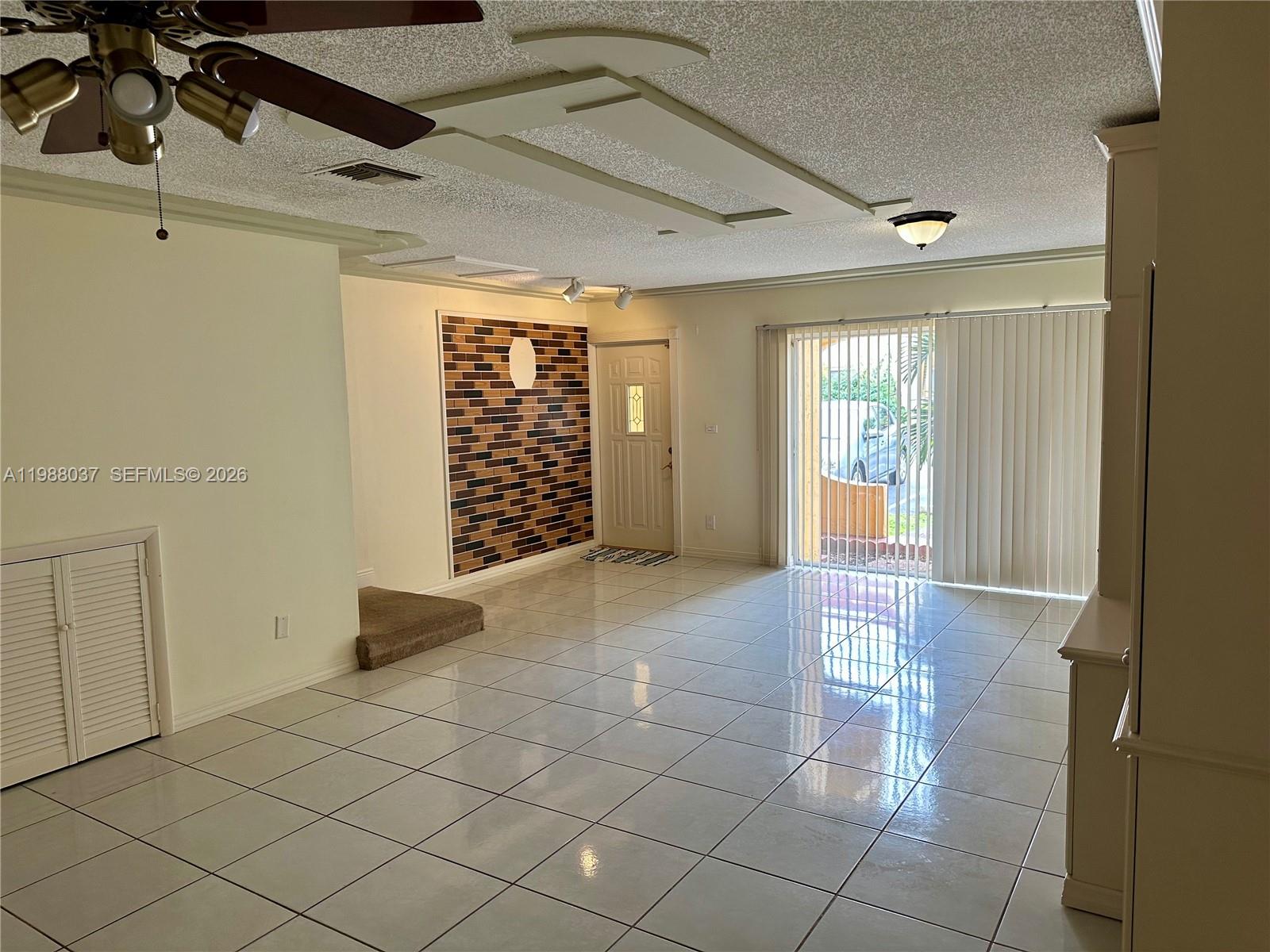 13705 Southwest 84th Street, Unit F Miami, FL 33143 - Photo 8 of 12 a view of an empty room and window