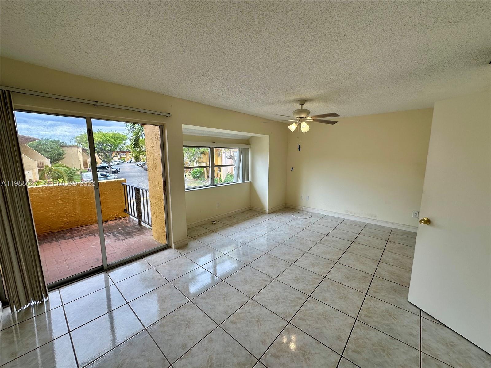 13705 Southwest 84th Street, Unit F Miami, FL 33143 - Photo 9 of 12 a view of a livingroom with furniture and staircase
