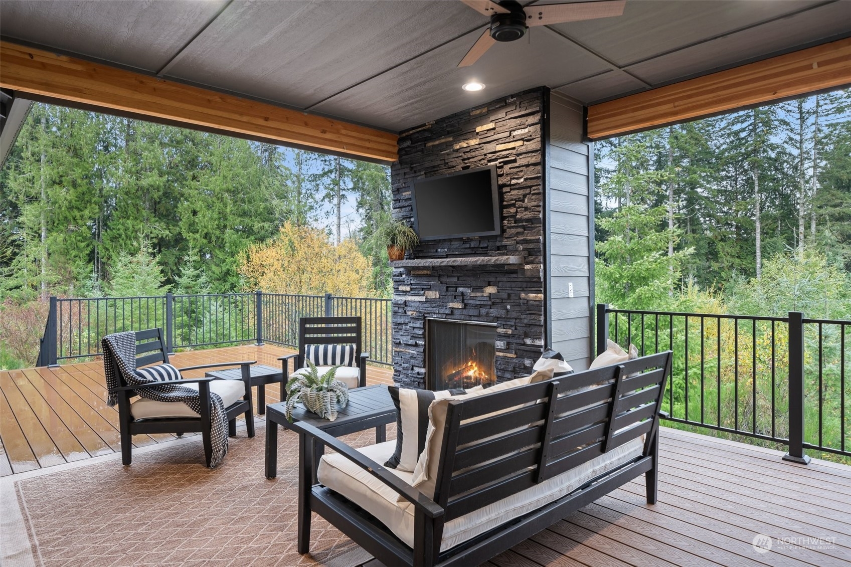 3336 McCary Road Southwest Port Orchard, WA 98367 - Photo 22 of 23 a outdoor space with patio furniture and a fireplace
