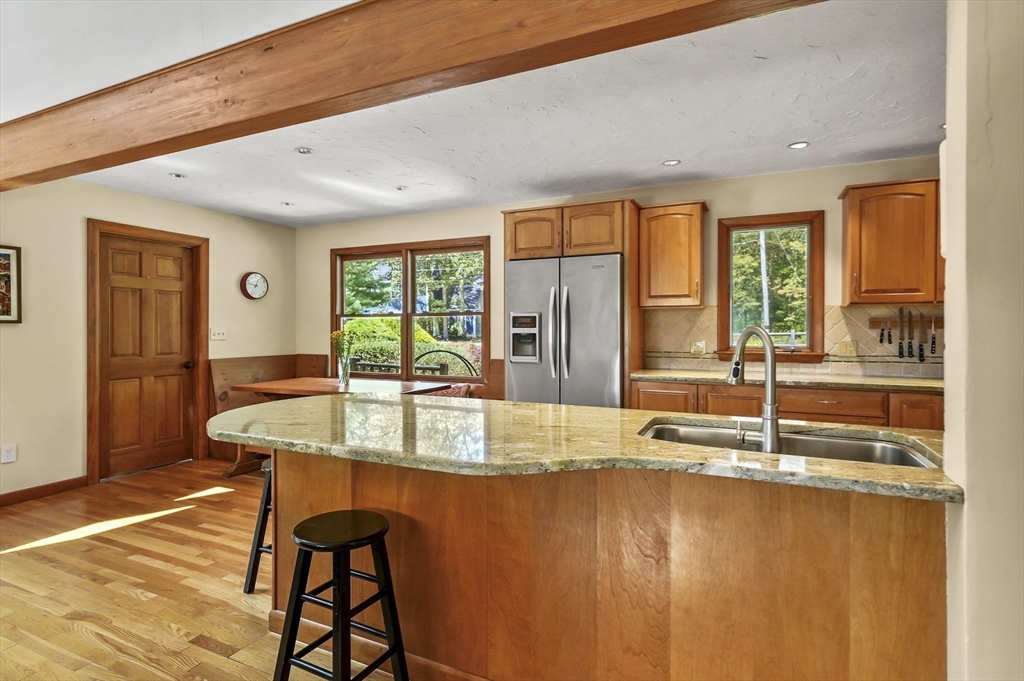 19 Sprague Road Clinton, MA 01510 - Photo 11 of 40 a kitchen with stainless steel appliances granite countertop sink and wooden floor