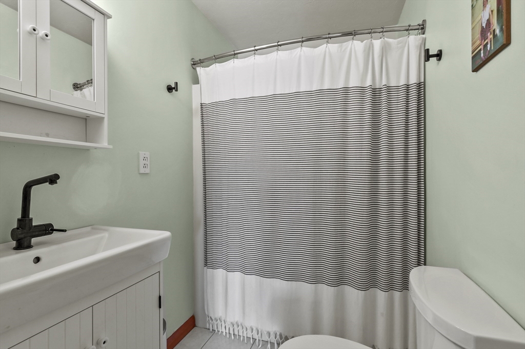 19 Sprague Road Clinton, MA 01510 - Photo 16 of 40 a bathroom with a sink and a mirror