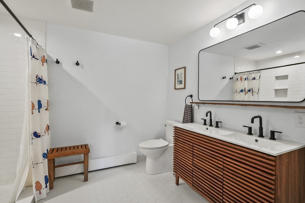 19 Sprague Road Clinton, MA 01510 - Photo 20 of 40 a bathroom with a sink toilet and shower