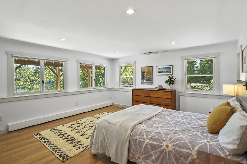 19 Sprague Road Clinton, MA 01510 - Photo 21 of 40 a bedroom with a bed and wooden floor