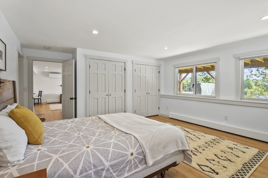 19 Sprague Road Clinton, MA 01510 - Photo 24 of 40 a bedroom with a bed and wooden floor