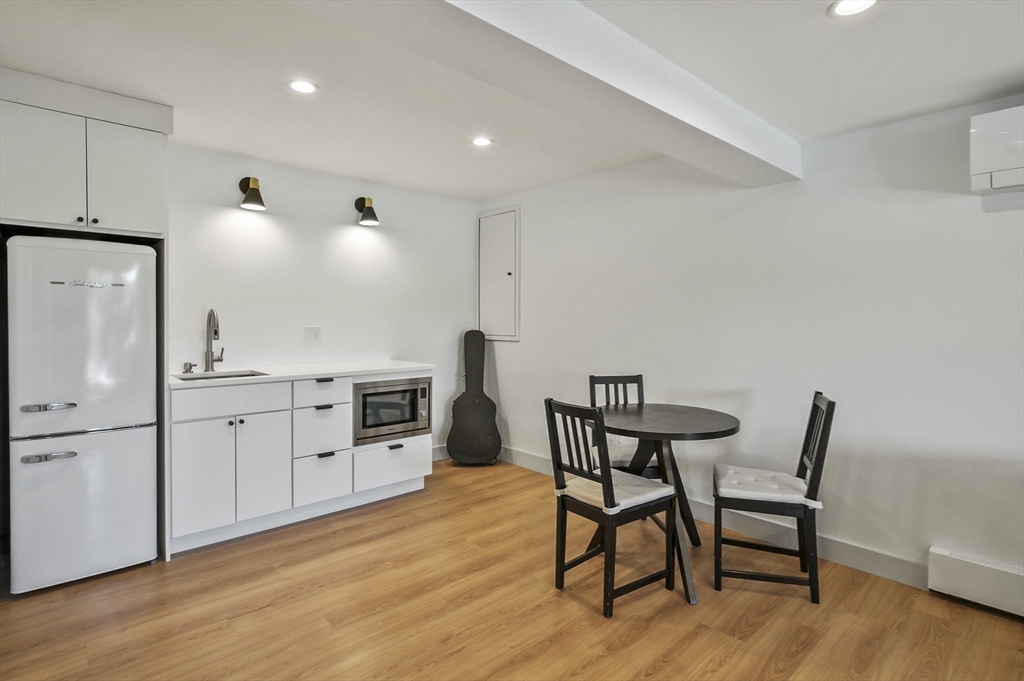 19 Sprague Road Clinton, MA 01510 - Photo 27 of 40 a kitchen with cabinets table and chairs