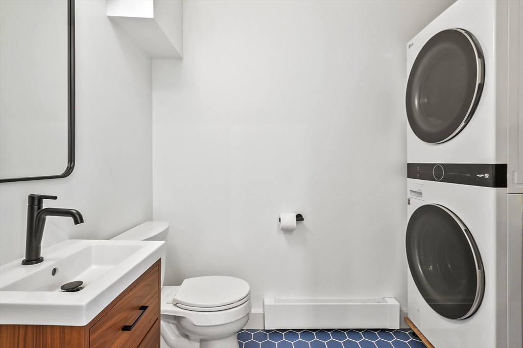 19 Sprague Road Clinton, MA 01510 - Photo 28 of 40 a bathroom with a sink a toilet and a mirror