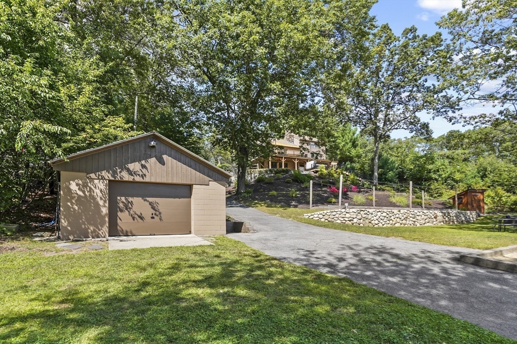 19 Sprague Road Clinton, MA 01510 - Photo 31 of 40 a front view of a house with a yard and garage