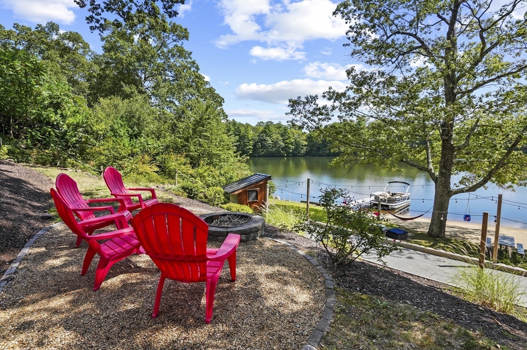 19 Sprague Road Clinton, MA 01510 - Photo 35 of 40 a view of a chairs and fire pit in the backyard