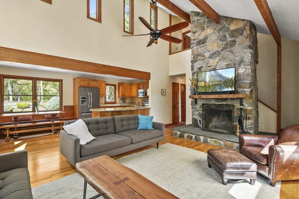 19 Sprague Road Clinton, MA 01510 - Photo 7 of 40 a living room with furniture a fireplace and a floor to ceiling window