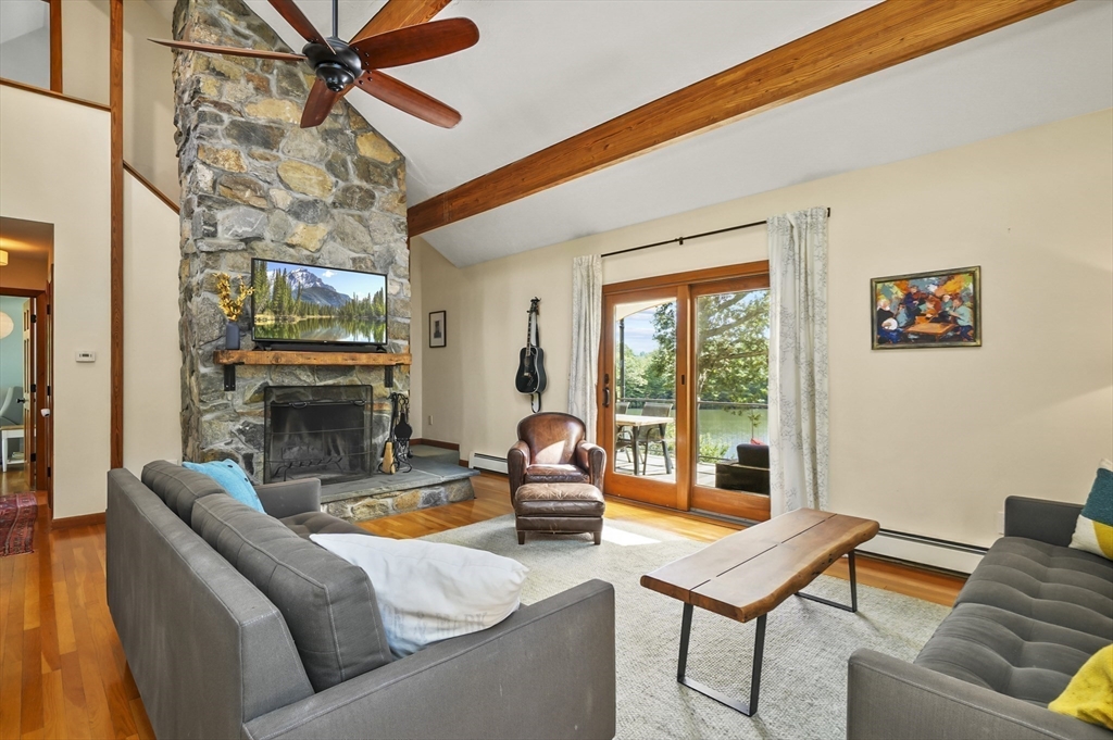19 Sprague Road Clinton, MA 01510 - Photo 8 of 40 a living room with furniture a fireplace and a chandelier