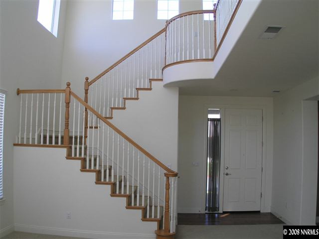 610 Equine Court Reno, NV 89521 - Photo 4 of 9 a view of staircase with lots of frames on wall and windows