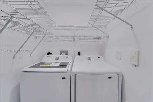 a utility room with dryer and washer