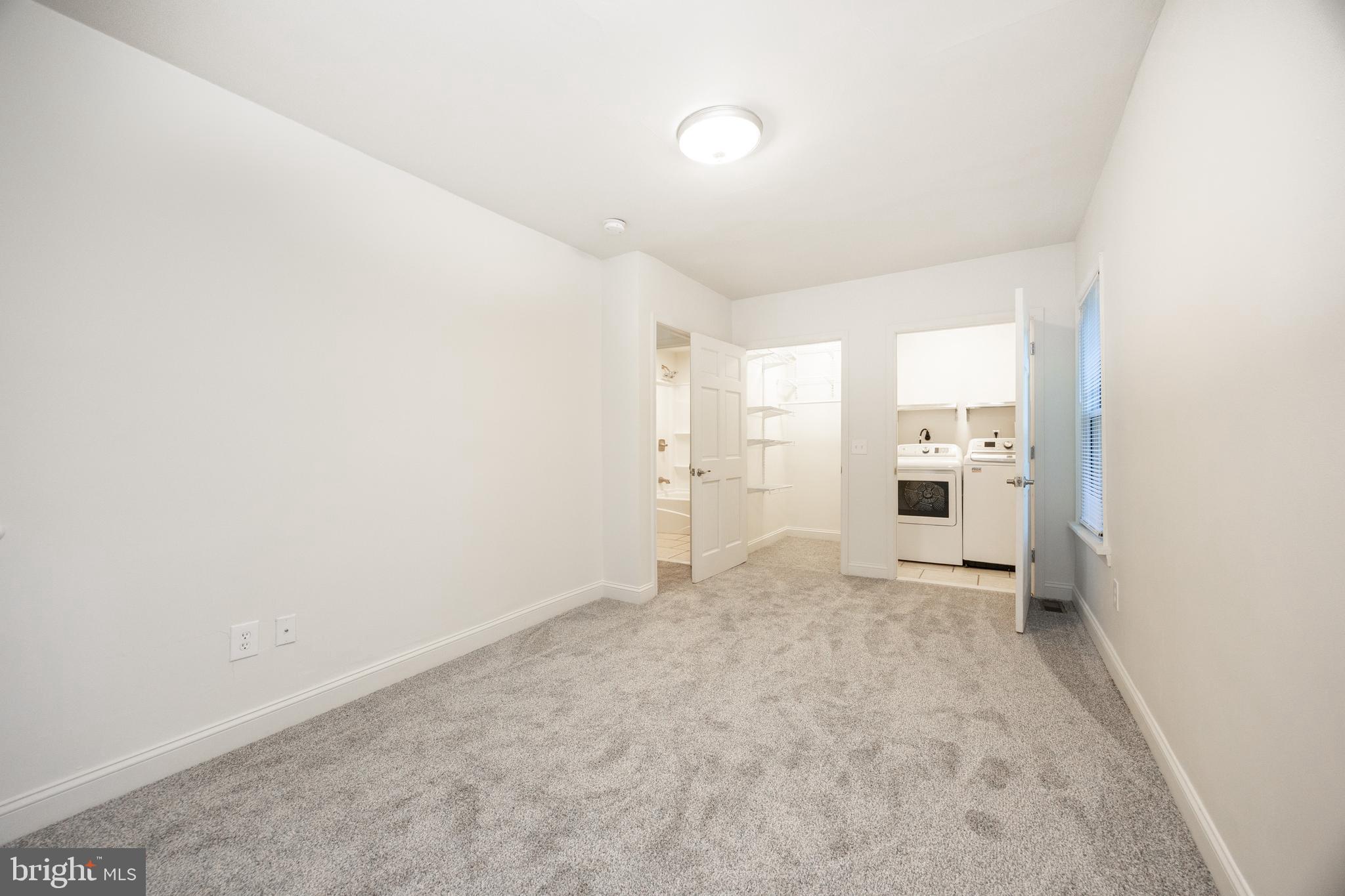 103 Valley View Road Phoenixville, PA 19460 - Photo 15 of 38 an empty room with white wall and windows