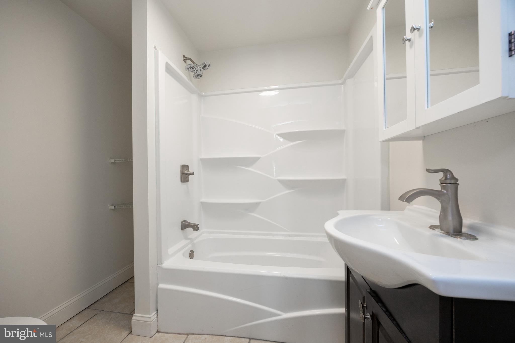 103 Valley View Road Phoenixville, PA 19460 - Photo 24 of 38 a bathroom with a sink and a mirror