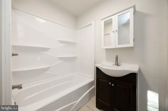 a bathroom with a sink and a bathtub