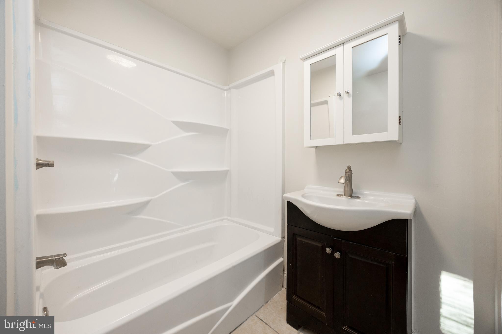 103 Valley View Road Phoenixville, PA 19460 - Photo 25 of 38 a bathroom with a sink and a bathtub