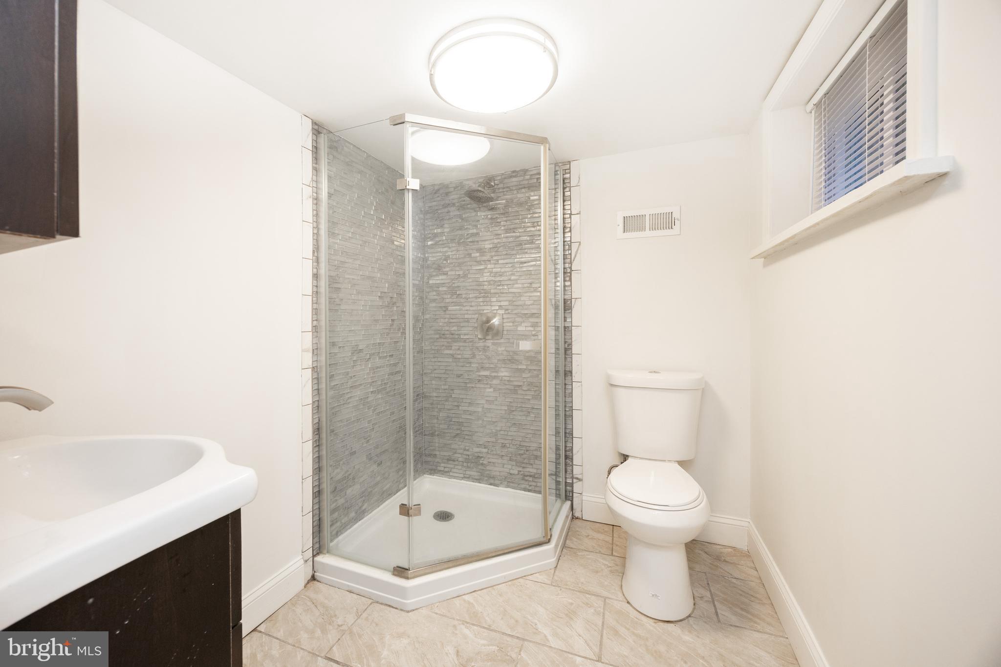 103 Valley View Road Phoenixville, PA 19460 - Photo 26 of 38 a bathroom with a sink a toilet and shower