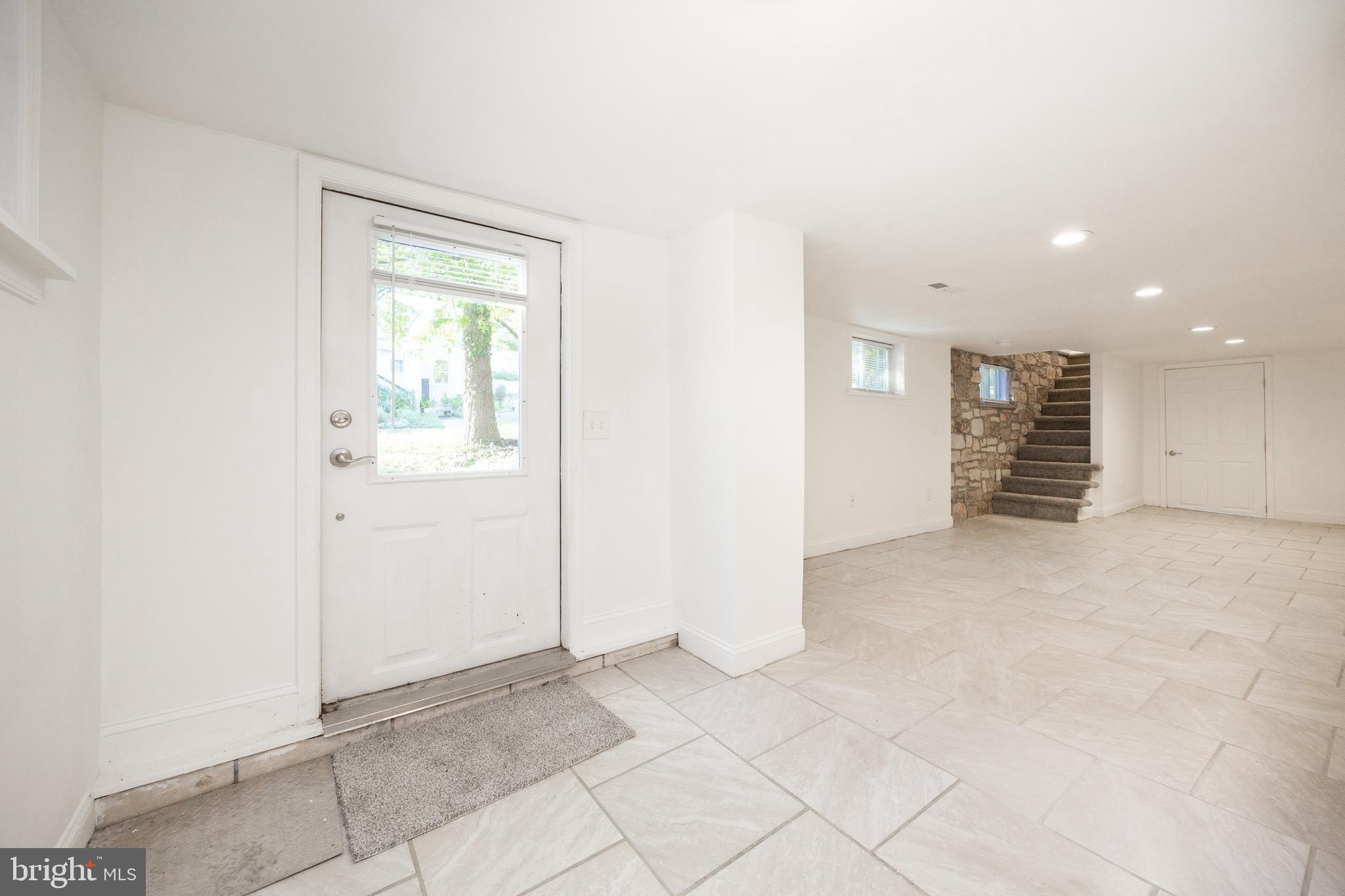 103 Valley View Road Phoenixville, PA 19460 - Photo 34 of 38 an empty room with kitchen view with wooden floor