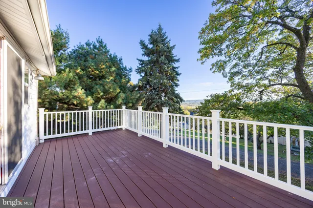a view of deck with wooden floor and fence
