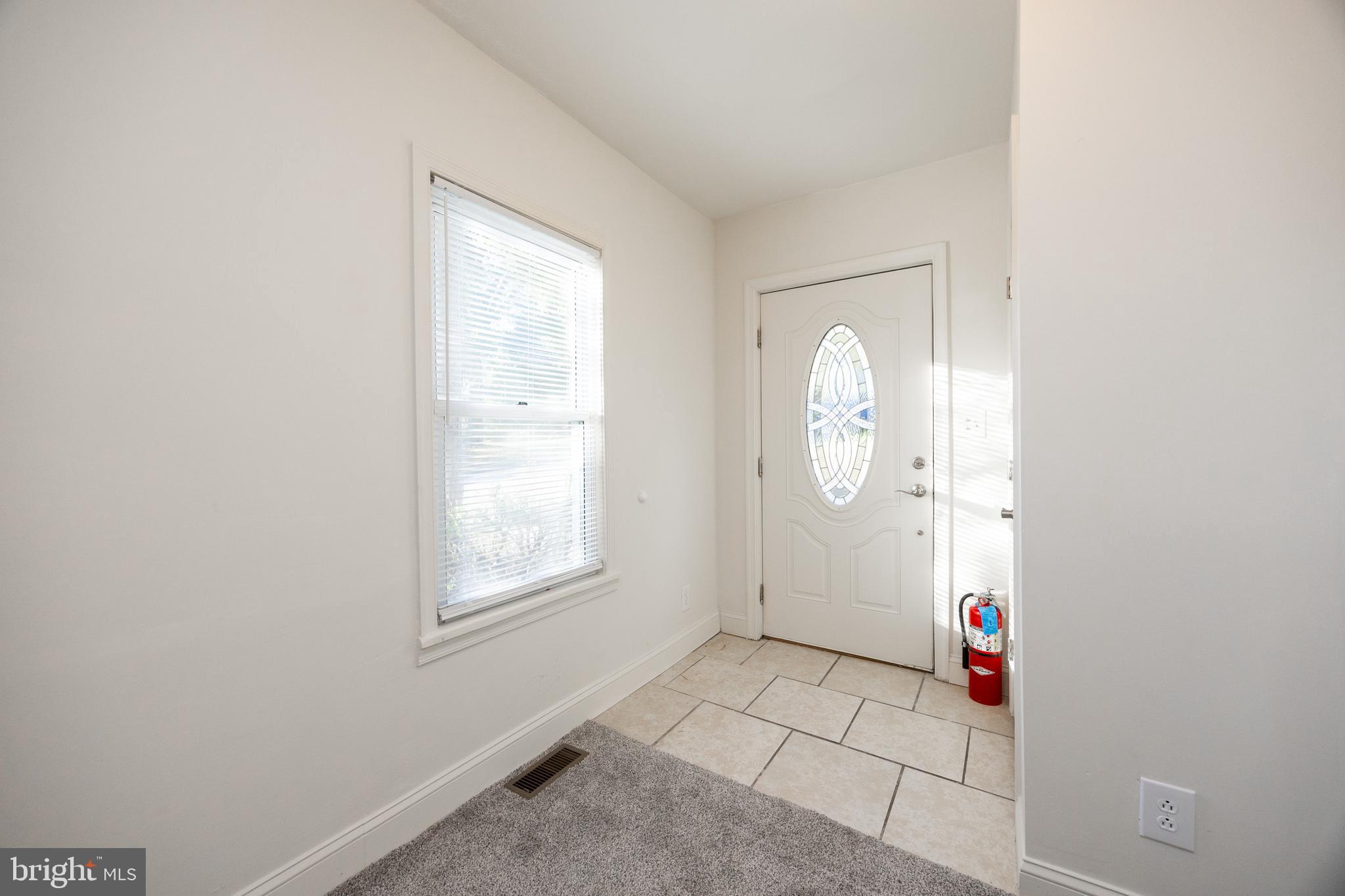 103 Valley View Road Phoenixville, PA 19460 - Photo 7 of 38 a area with window and door