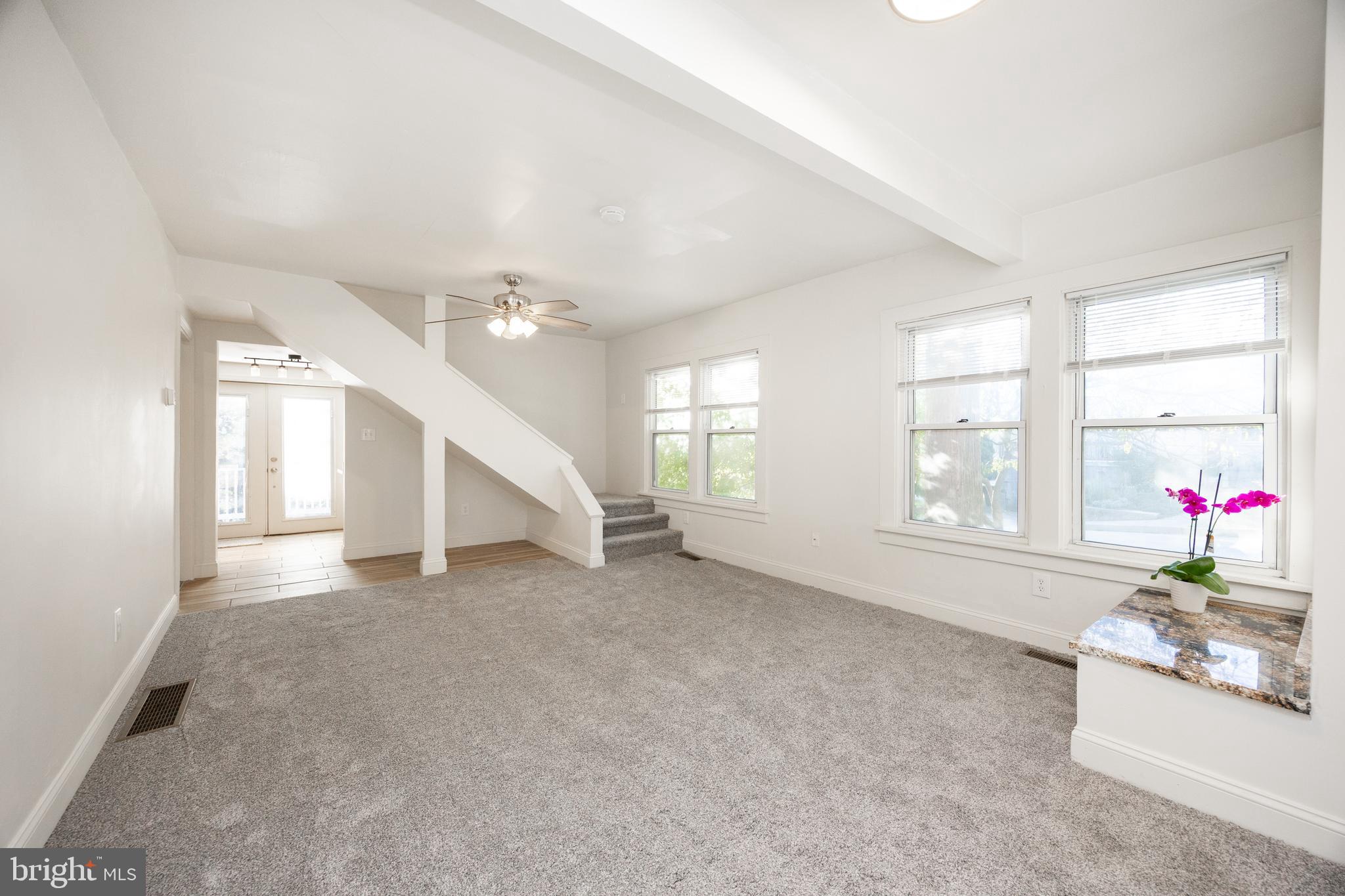 103 Valley View Road Phoenixville, PA 19460 - Photo 8 of 38 wooden floor in an empty room with a window