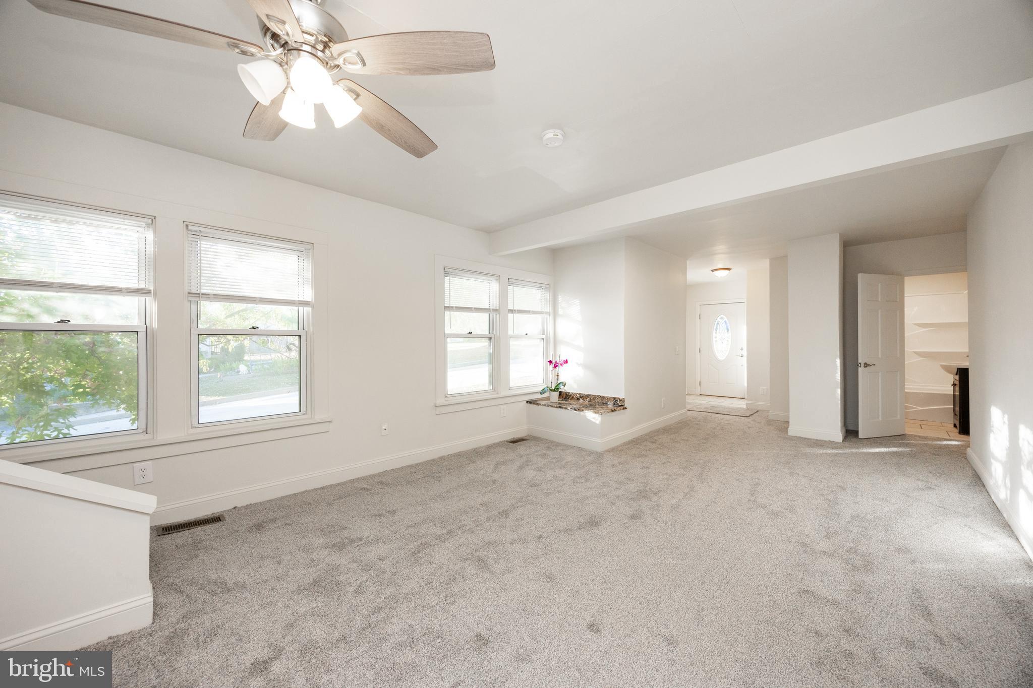 103 Valley View Road Phoenixville, PA 19460 - Photo 9 of 38 a view of an empty room with a window