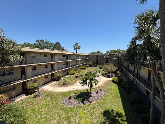 11485 Oakhurst Road, Unit 319 Largo, FL 33774 - Photo 30 of 63 a view of a swimming pool with a patio