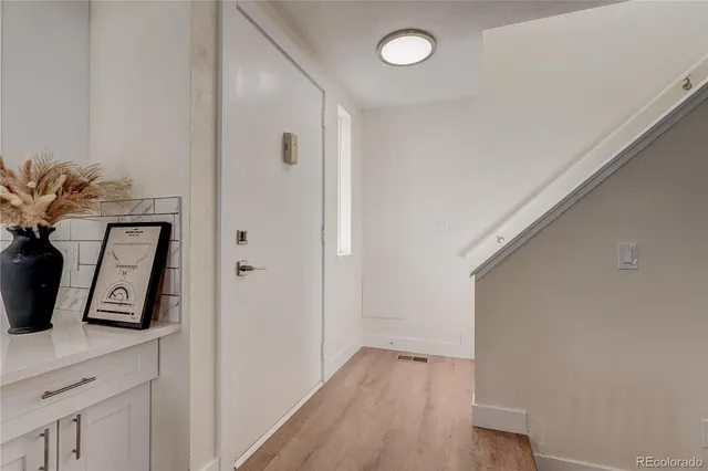 a view of kitchen with wooden floor