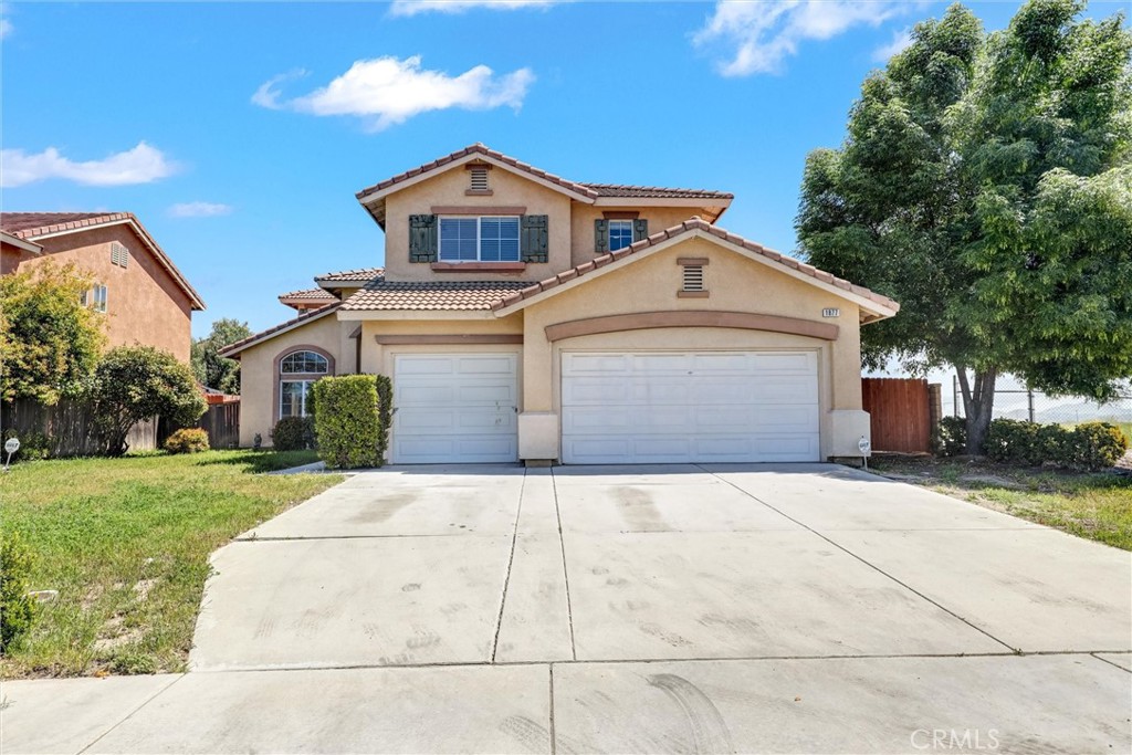 1877 Murrieta Road Perris, CA 92571 - Photo 1 of 1 a front view of a house with a yard