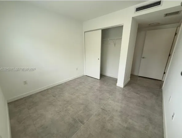 an empty room with closet