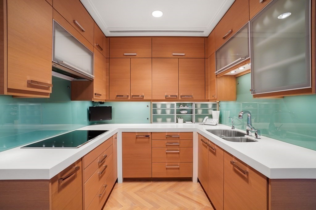 2 Commonwealth Avenue, Unit PH2 & 16E Boston, MA 02116 - Photo 17 of 24 a kitchen with a sink and cabinets