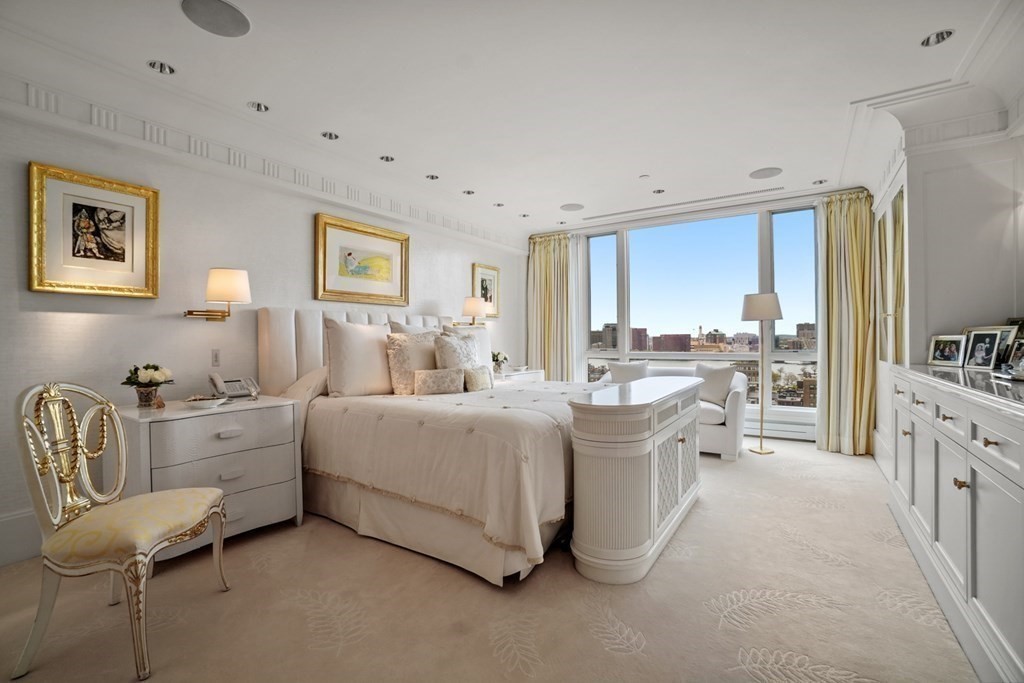 2 Commonwealth Avenue, Unit PH2 & 16E Boston, MA 02116 - Photo 22 of 24 a living room with furniture and a large window