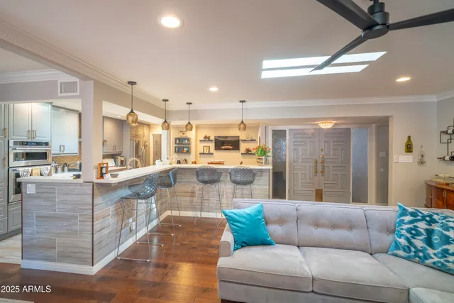 a kitchen with stainless steel appliances granite countertop a refrigerator and a stove