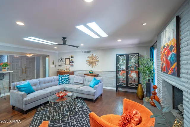 a kitchen with stainless steel appliances granite countertop a sink and refrigerator