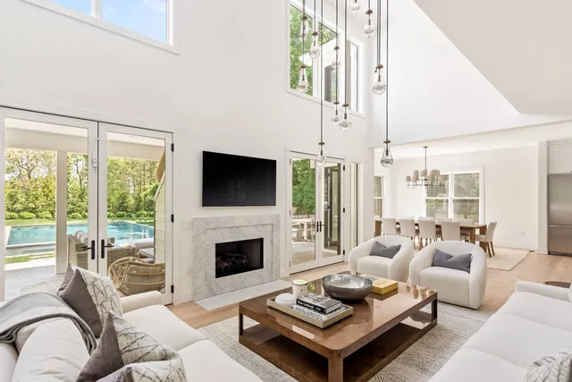 a living room with furniture fireplace and a flat screen tv