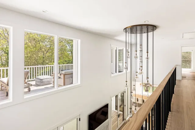 a view of an entryway with wooden floor and windows