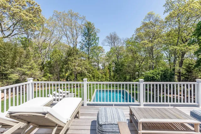 a view of a wooden chairs and deck