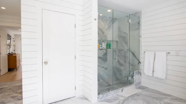 a bathroom with a shower and a sink