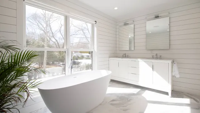 a spacious bathroom with a bathtub and sink