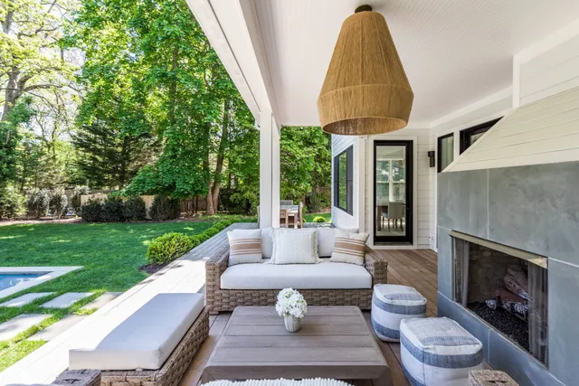 a outdoor space with patio the couches and a dining table with garden view