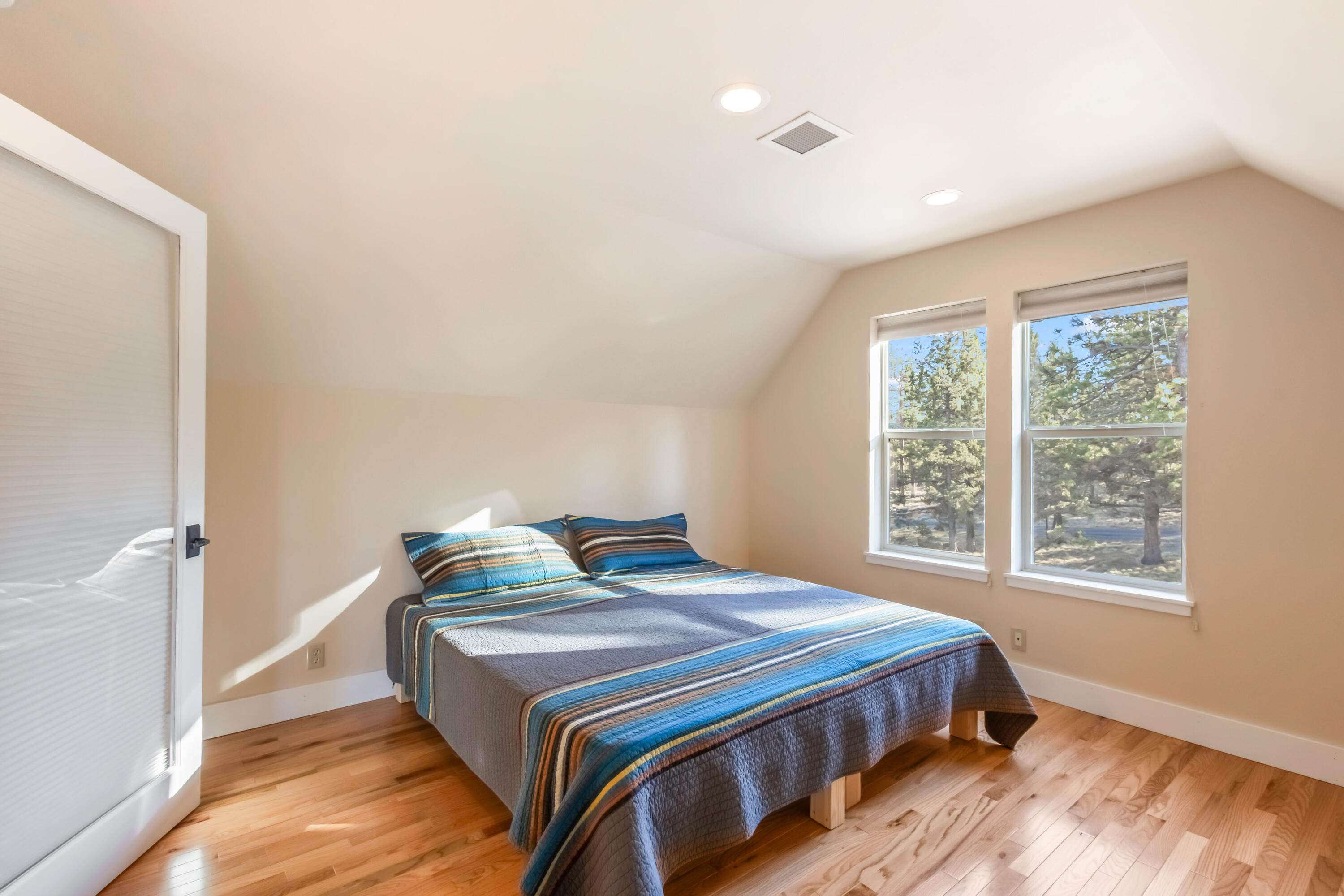 69590 Omaha Road Sisters, OR 97759 - Photo 30 of 46 a bedroom with a bed and a window