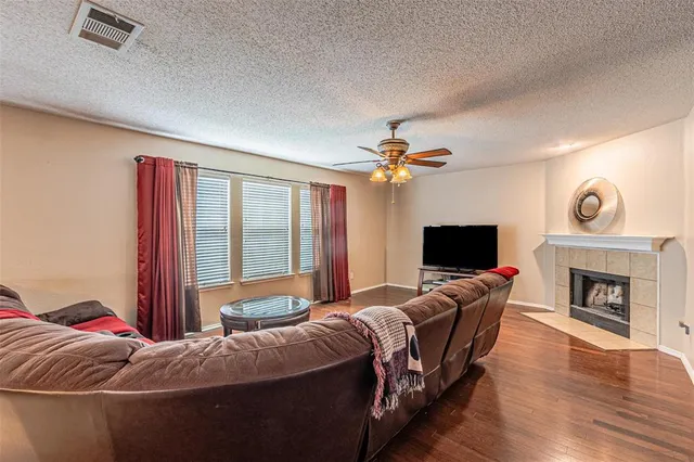 a bedroom with bed and a fireplace