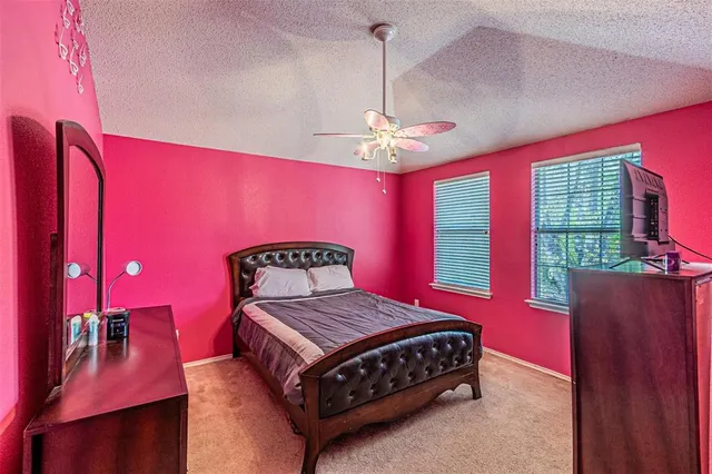 a bathroom with a toilet and a shower curtain