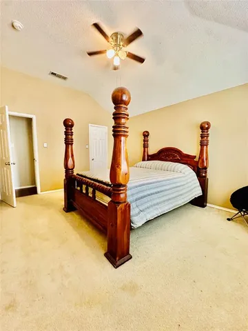 a balcony with furniture and a potted plant