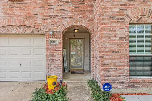 a view of entrance gate of a brick building