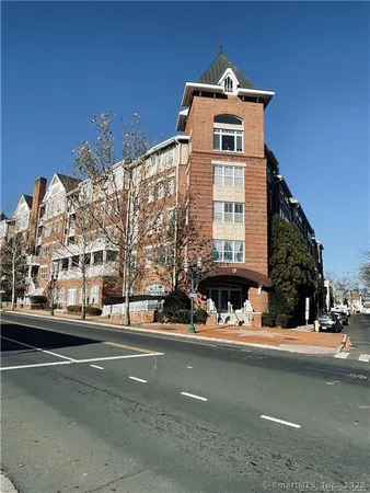 a front view of a building with street view