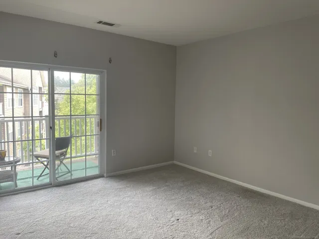 wooden floor and window in an empty room