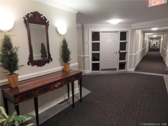 a view of a bathroom with a sink and mirror