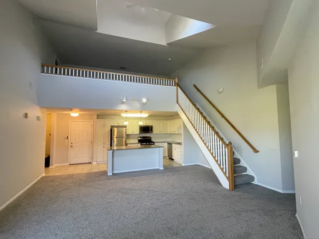 a view of a hallway with staircase